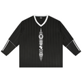 Tonal black jacquard soccer jersey with contrast V-neck, striped sleeves and Teddy Blaze Afrodemia Americana artwork. A refined Afrocentric athletic-prep statement.