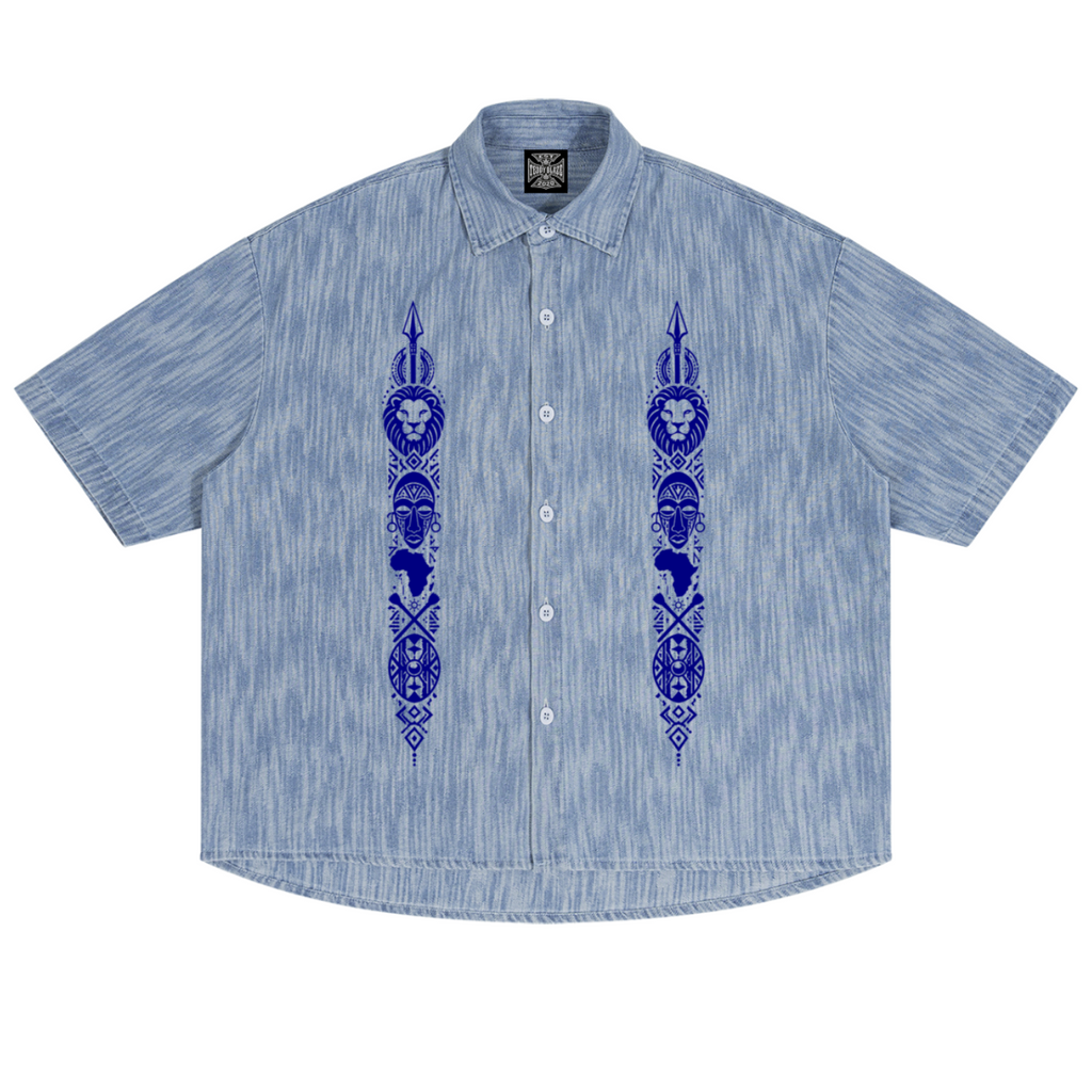 Discover the Teddy Blaze Afrodemia Boxy Vintage Wash Denim Camp Shirt, featuring Afrocentric graphics, a relaxed unisex fit and Afrodemia Americana detailing.
