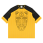 A yellow and black short-sleeve t-shirt with a large black line art graphic of a stylized face on the front, set against a plain white background.