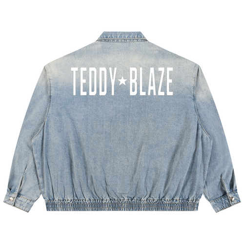 Elevate your casual outerwear with the House of Teddy Blaze Statement Vintage Wash Denim Jacket. Light wash 320 gsm cotton denim, zip front, elastic hem, and bold star block typography. Shop NYC to Vegas style.