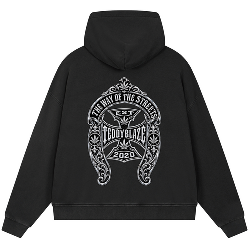 A black pullover hoodie shown from the back, featuring a large white graphic print with the text 'The Way of the Stigmas', 'Teddy Blaze', and '2020' on a plain white background.