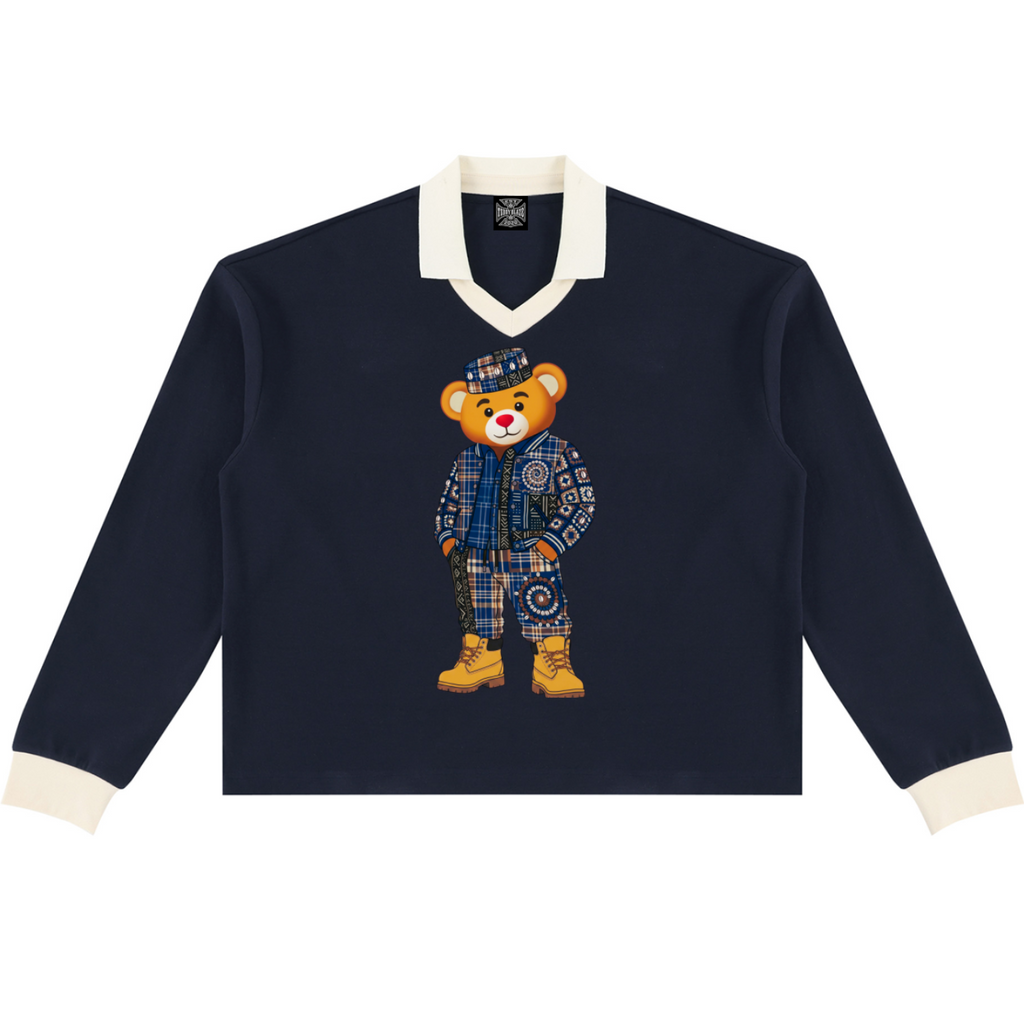 A heavyweight unisex rugby shirt featuring Bearatoo in Afrodemia style, with a navy body, cream contrast trim and relaxed collegiate silhouette.