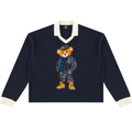 A heavyweight unisex rugby shirt featuring Bearatoo in Afrodemia style, with a navy body, cream contrast trim and relaxed collegiate silhouette.