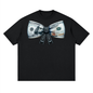A black short-sleeve crewneck t-shirt featuring a graphic print of a dollar bill ribbon bow made of US $100 bills, with the words 'I LOVE YOU' printed down the center.