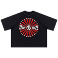 A black raglan-style t-shirt with a circular graphic on the chest reading 'TEDDY BLAZE' in white over a red and black sunburst design with white stars.