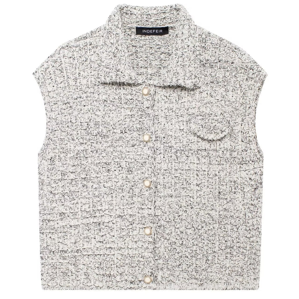 Shop the Bouclé Tweed Sleeveless Vest by Teddy Blaze. Single-breasted lapel vest featuring pearl buttons and textured bouclé tweed from THE IVY WOMAN collection.