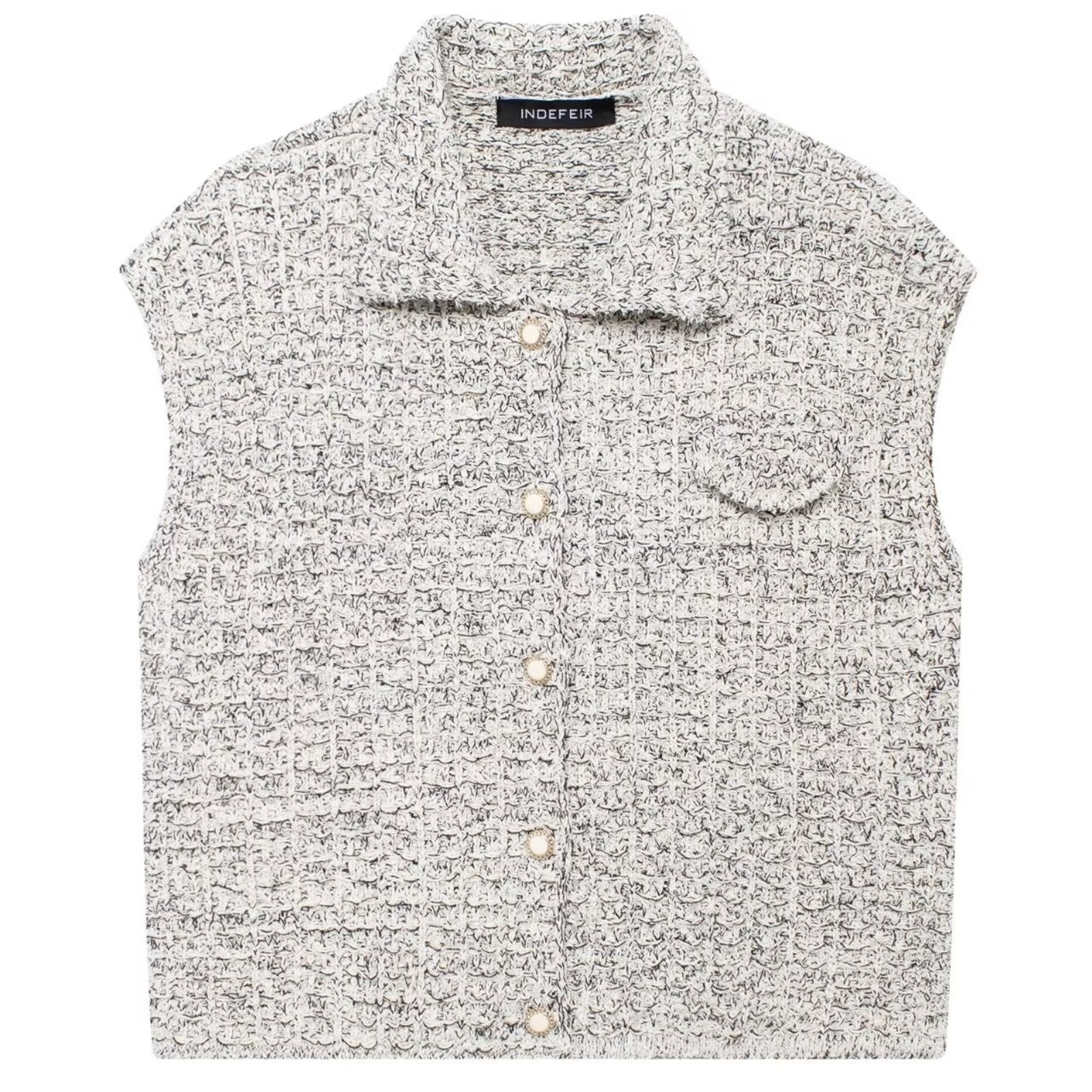 Shop the Bouclé Tweed Sleeveless Vest by Teddy Blaze. Single-breasted lapel vest featuring pearl buttons and textured bouclé tweed from THE IVY WOMAN collection.