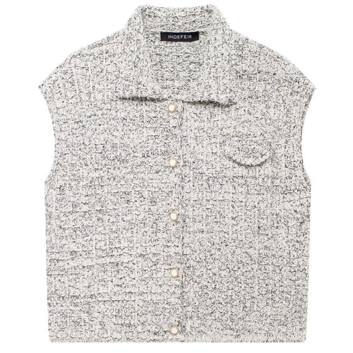 Shop the Bouclé Tweed Sleeveless Vest by Teddy Blaze. Single-breasted lapel vest featuring pearl buttons and textured bouclé tweed from THE IVY WOMAN collection.