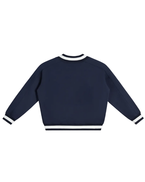 Shop the Iron + Ivy Signature Contrast Collar Cotton Boxy Jumper by Teddy Blaze. Heavyweight 380 GSM navy cotton V-neck jumper with striped ribbed trim and golf bear chest graphic.
