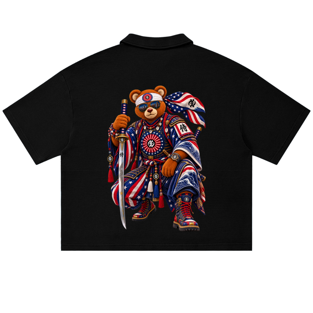 Shop the Teddy Blaze Brand Rising Waffle Knit Boxy Polo with textured cotton-blend construction, Gye Nyame branding and bold Teddy Blaze Samurai artwork.