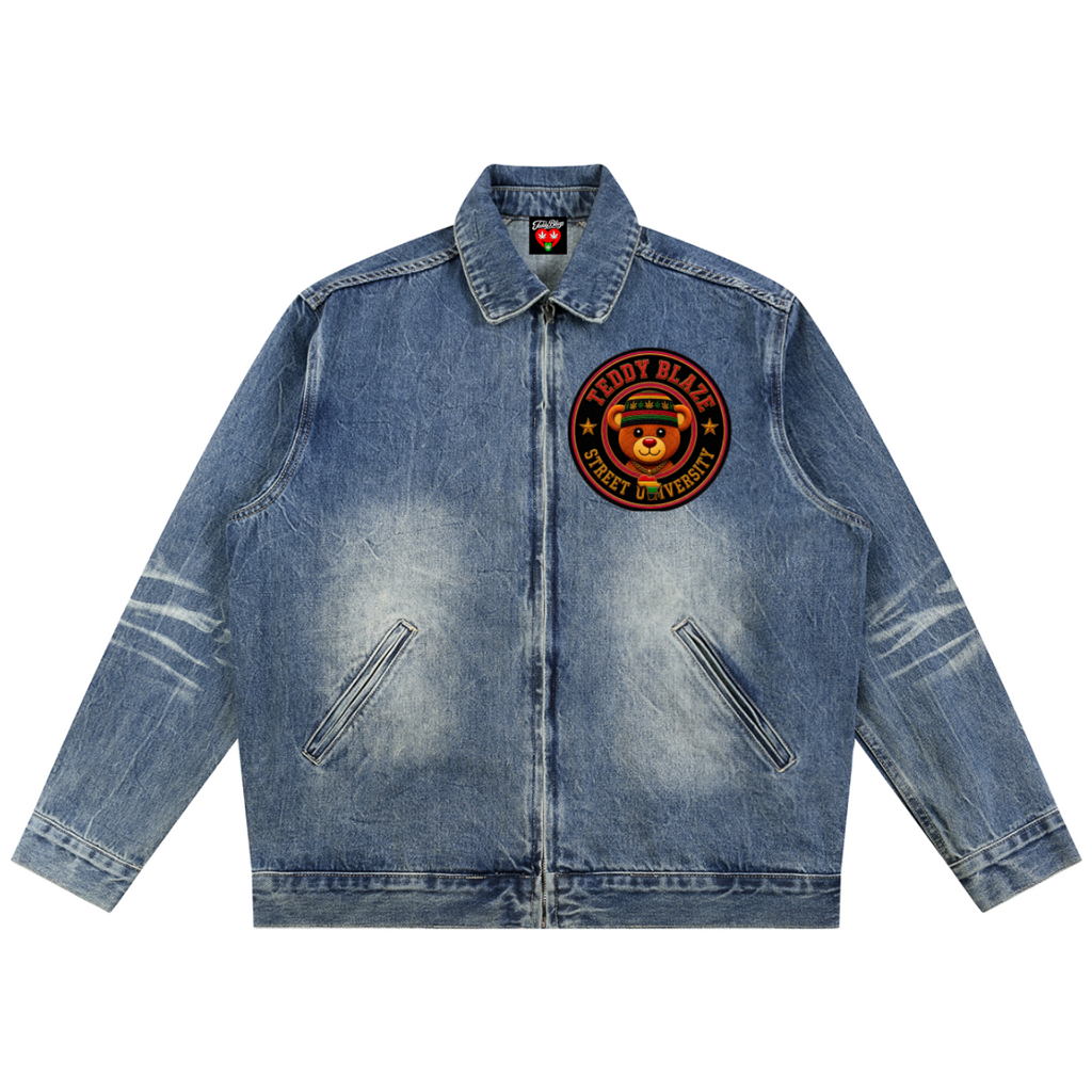 A light blue denim jacket with a circular embroidered patch on the left chest featuring a bear and the text 'BERRY BERRY', shown flat against a white background.