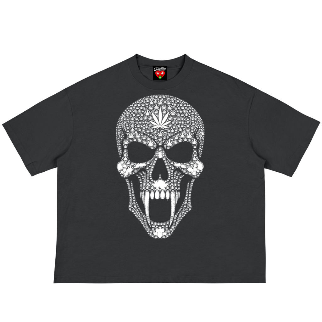 A black short-sleeve t-shirt featuring a large white skull graphic on the front, decorated with a dotted pattern and a cannabis leaf on the forehead. The shirt is displayed flat against a solid white background.