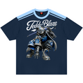 A navy blue short-sleeve t-shirt with a light blue shoulder stripe pattern and a large graphic of a robotic teddy bear wearing armor. The text 'Teddy Blaze' is printed in white across the chest.