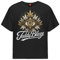 A black short-sleeve crewneck t-shirt featuring a graphic design of an all-seeing eye surrounded by cannabis leaves, with the text 'Teddy Blaze' written in white script below, displayed on a solid white background.