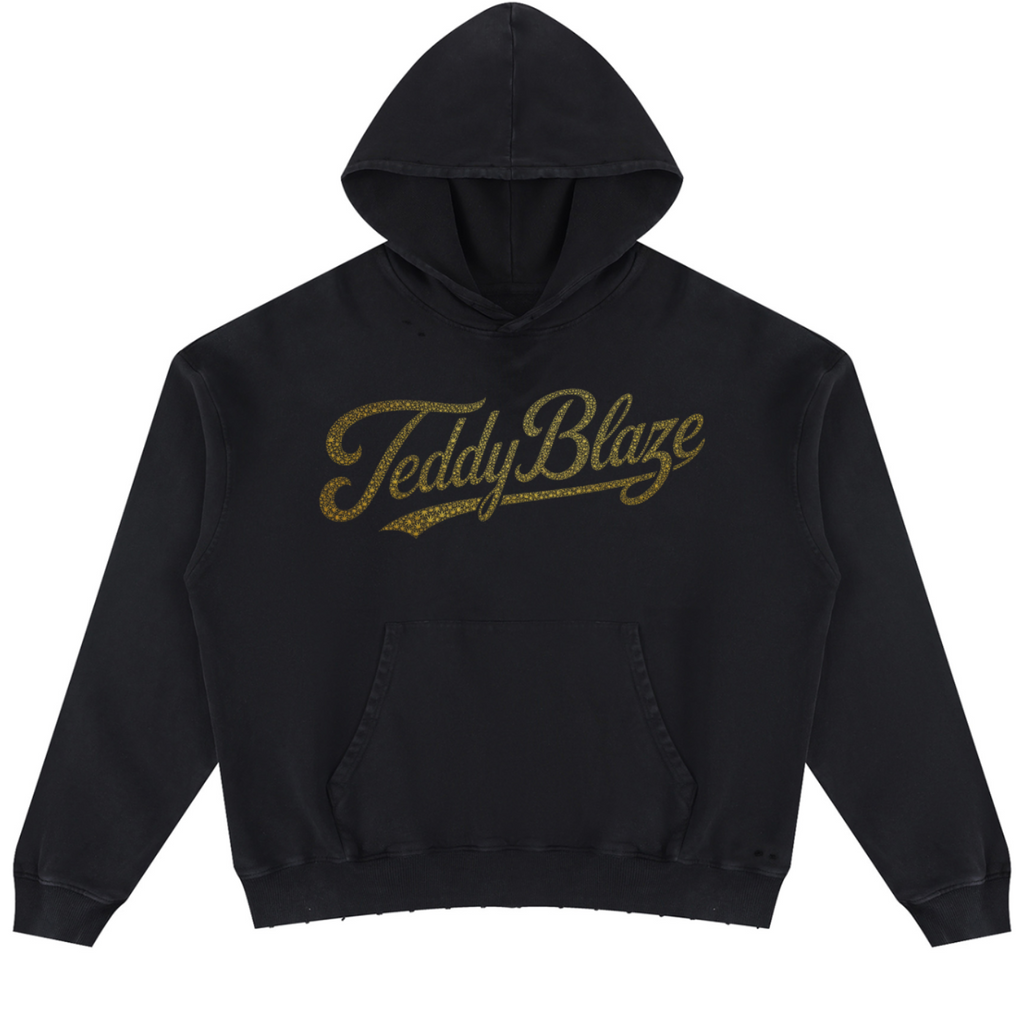 A black pullover hoodie with 'Teddy Blaze' printed across the chest in a textured gold script, displayed on a clean white background.