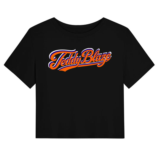 A black short-sleeve crop top t-shirt featuring a stylized 'Teddy Blaze' logo printed across the chest in orange and white script.