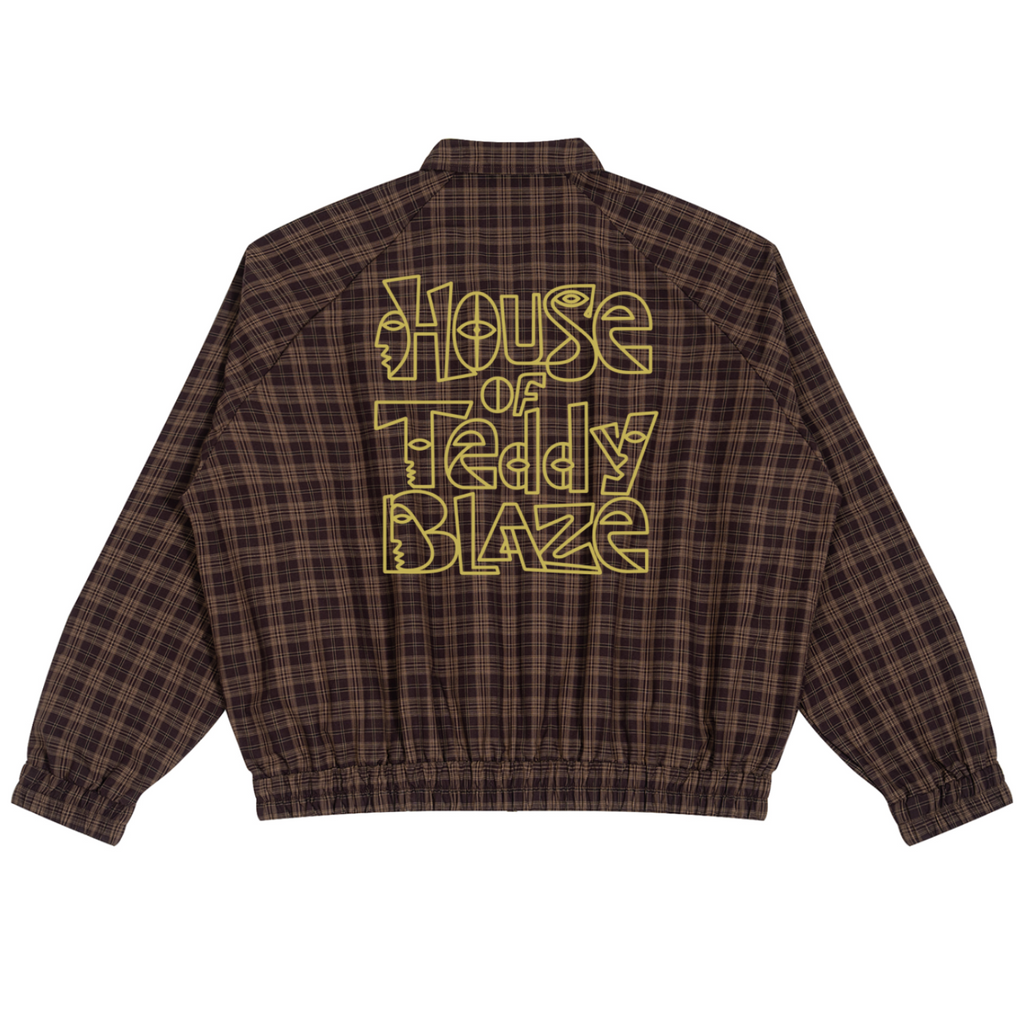 A brown and black plaid jacket shown from the back, featuring a large yellow graphic text print that reads 'House of Teddy Blaze'.