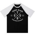 A black and white raglan baseball t-shirt with a white graphic print on the front reading 'TEDDY BLAZE', 'STREETWEAR UNIVERSITY', and 'EST. 2020'.
