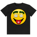 A black short-sleeve crewneck t-shirt featuring a large yellow smiley face graphic on the chest. The graphic has white cannabis leaves for eyes, a black mustache, a red tongue, and a white cannabis leaf on the tongue.