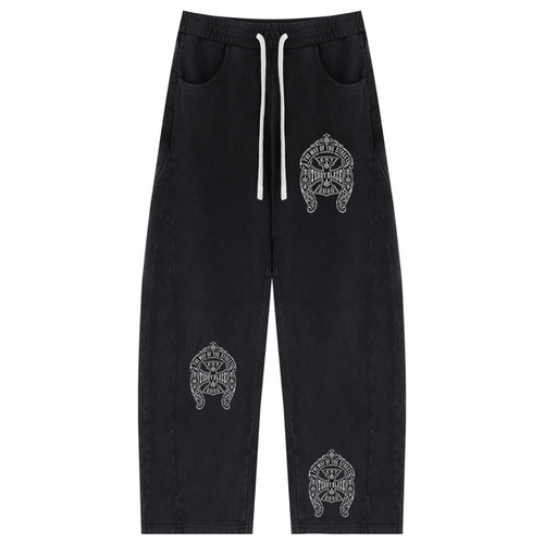 Black drawstring sweatpants with three white embroidered tribal-style logos, one on the right thigh and two on the lower legs, shown flat on a white background.