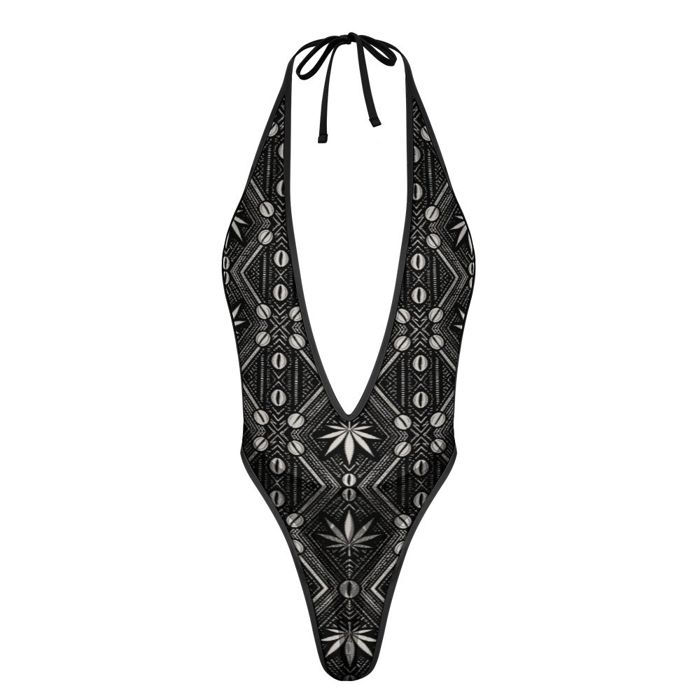 Shop the DaChek Deep-V Thongkini with a plunging neckline, halter ties, high-cut legs and a bold black-and-white Teddy Blaze pattern.