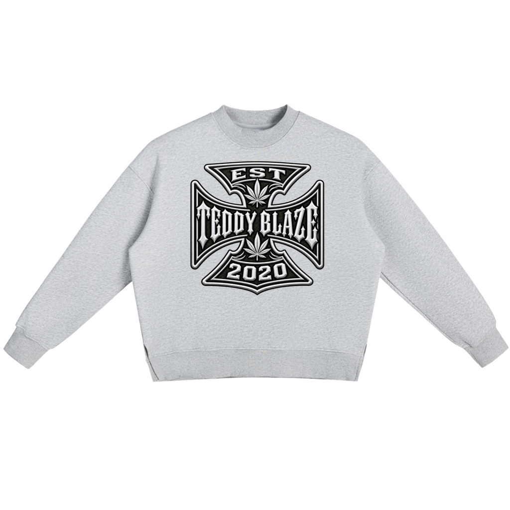 Shop the DaCruz Fleece Side Slit Jumper by Teddy Blaze. 350 GSM heavy fleece heather grey oversized jumper with side slits and Maltese cross graphic from ON TOP.