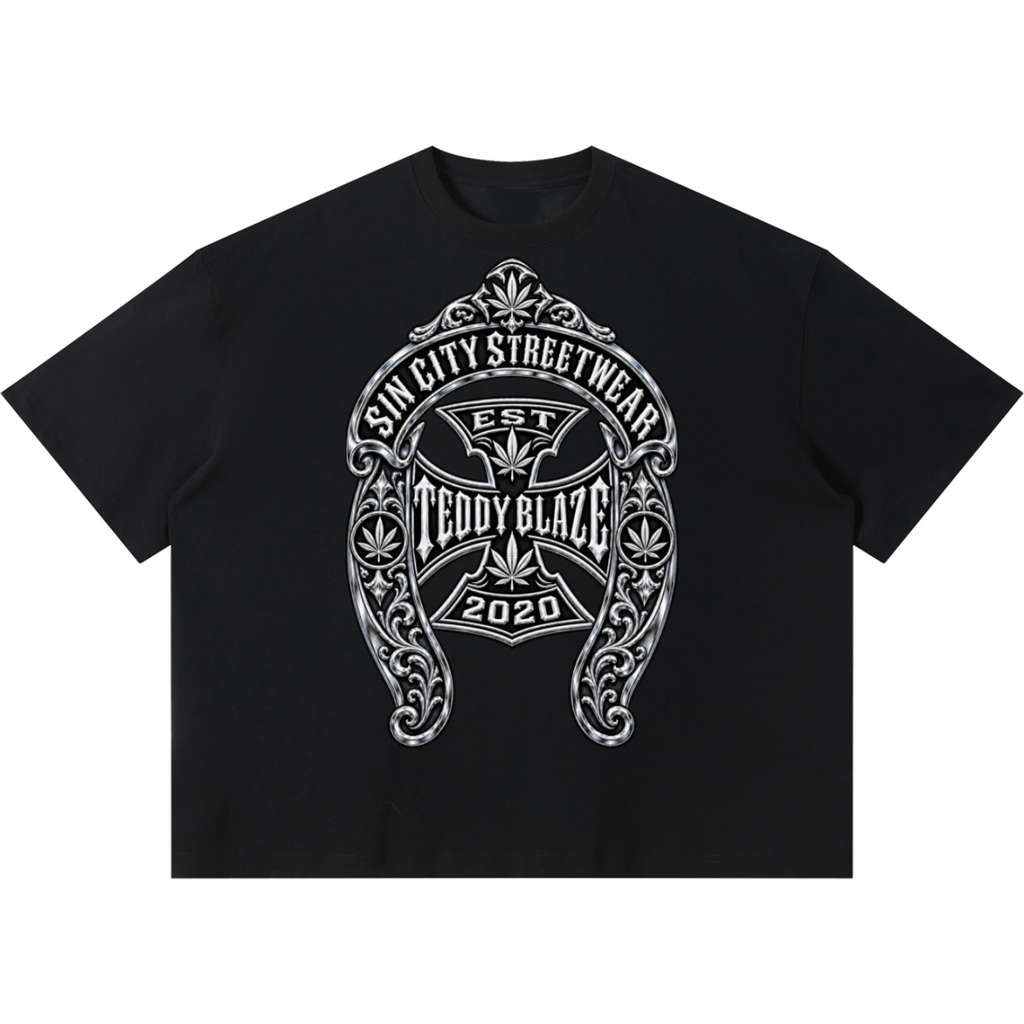 Shop the DaCruz Shoe Boxy Tee by Teddy Blaze. 220 GSM cotton-poly oversized drop-shoulder t-shirt with silver horseshoe filigree graphic from TOPS BY TEDDY BLAZE.
