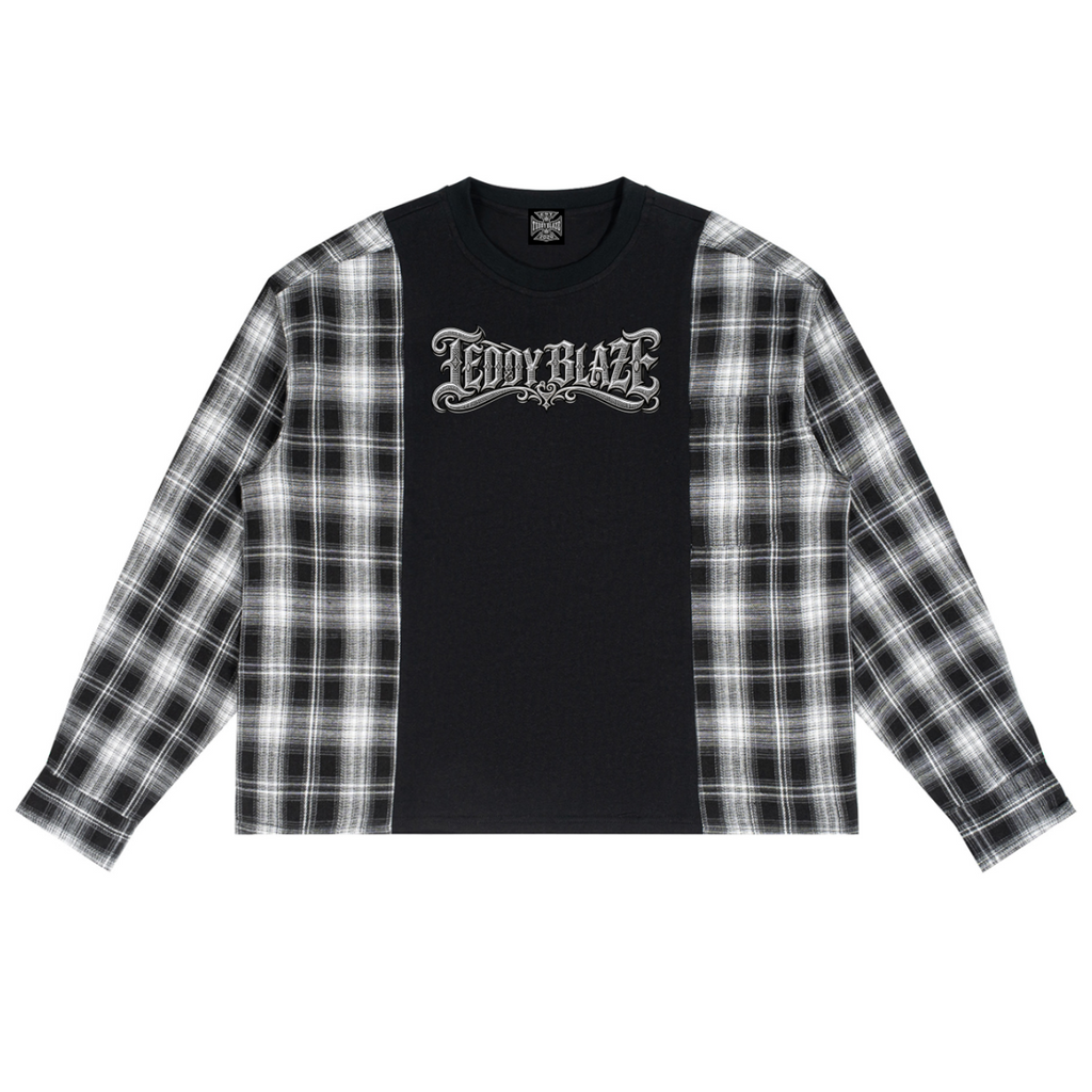 A long-sleeve crop top featuring a solid black center panel with a gothic 'TEDDY BLAZE' graphic, and black-and-white plaid sleeves, shown flat on a white background.
