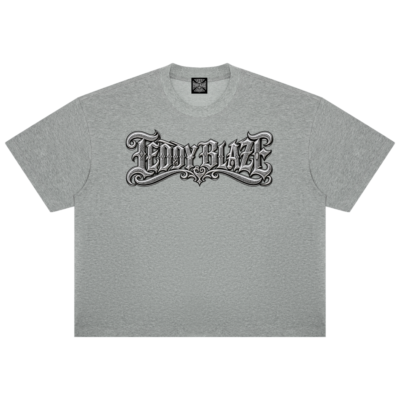 A heather gray short-sleeve t-shirt with a stylized black and white gothic-style 'TEDDY BLAZE' graphic printed across the chest, displayed flat against a solid white background.