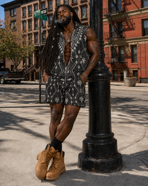 Sleeveless DaChek zip-up hoodie in scuba fabric with dashiki-inspired paneling, side pockets, and a bold DaCruz back graphic.