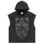 A sleeveless hooded crop top in washed black denim featuring a large white line-art graphic of an African-style mask on the front, shown against a plain white background.