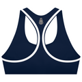 A navy blue sports bra with white contrast trim and a small metallic monogram logo at the center back of the neckline, shown on a plain white background.