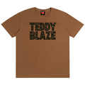 A brown short-sleeve crewneck t-shirt with 'TEDDY BLAZE' printed in black block letters across the chest, displayed flat against a solid white background.