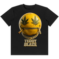 A black short-sleeve t-shirt with a graphic of a yellow smiley face zipped closed, featuring cannabis leaves for eyes, a gold chain, a gold cigarette, and the text 'TEDDY BLAZE' below.