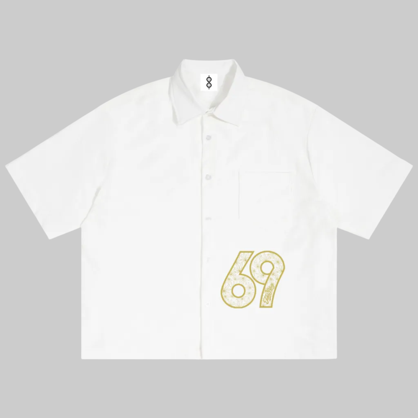 A white short-sleeve button-up shirt with a small yellow graphic print of the number 69 on the lower right front, displayed flat against a white background.
