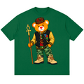 A green short-sleeve crewneck t-shirt featuring a cartoon graphic of a teddy bear dressed in a varsity jacket, camouflage pants, a plaid hat, and holding an ankh symbol staff.