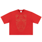 A red short-sleeve t-shirt with a large tan line-art graphic of a stylized face on the front, displayed flat against a white background.