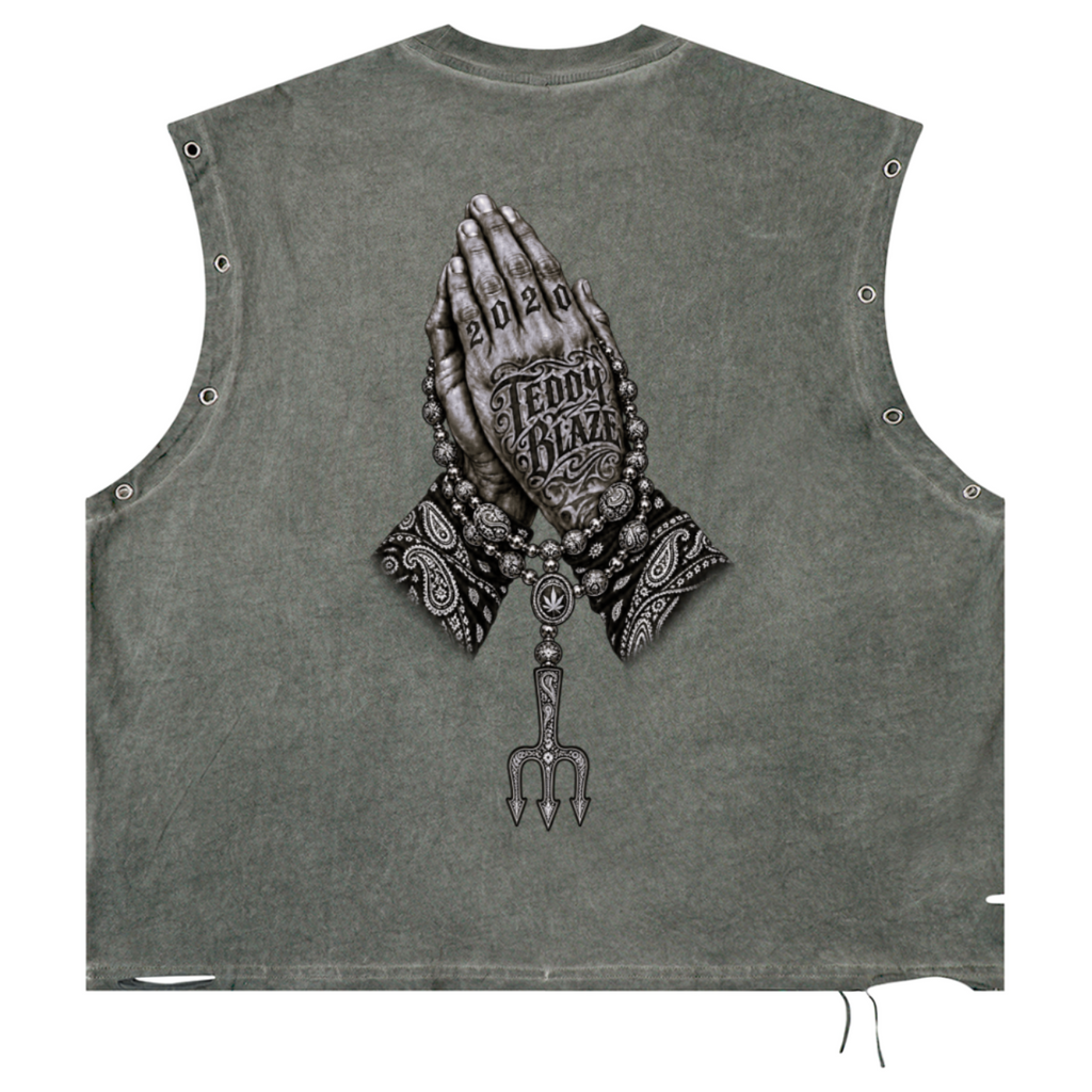 Elevate your sleeveless style with the Teddy Blaze Sin City Distressed Grommet Eyelet Cotton Tank. Wash olive cotton, metal eyelet trim, distressed details, and tattoo back print. Shop NYC to Vegas style.