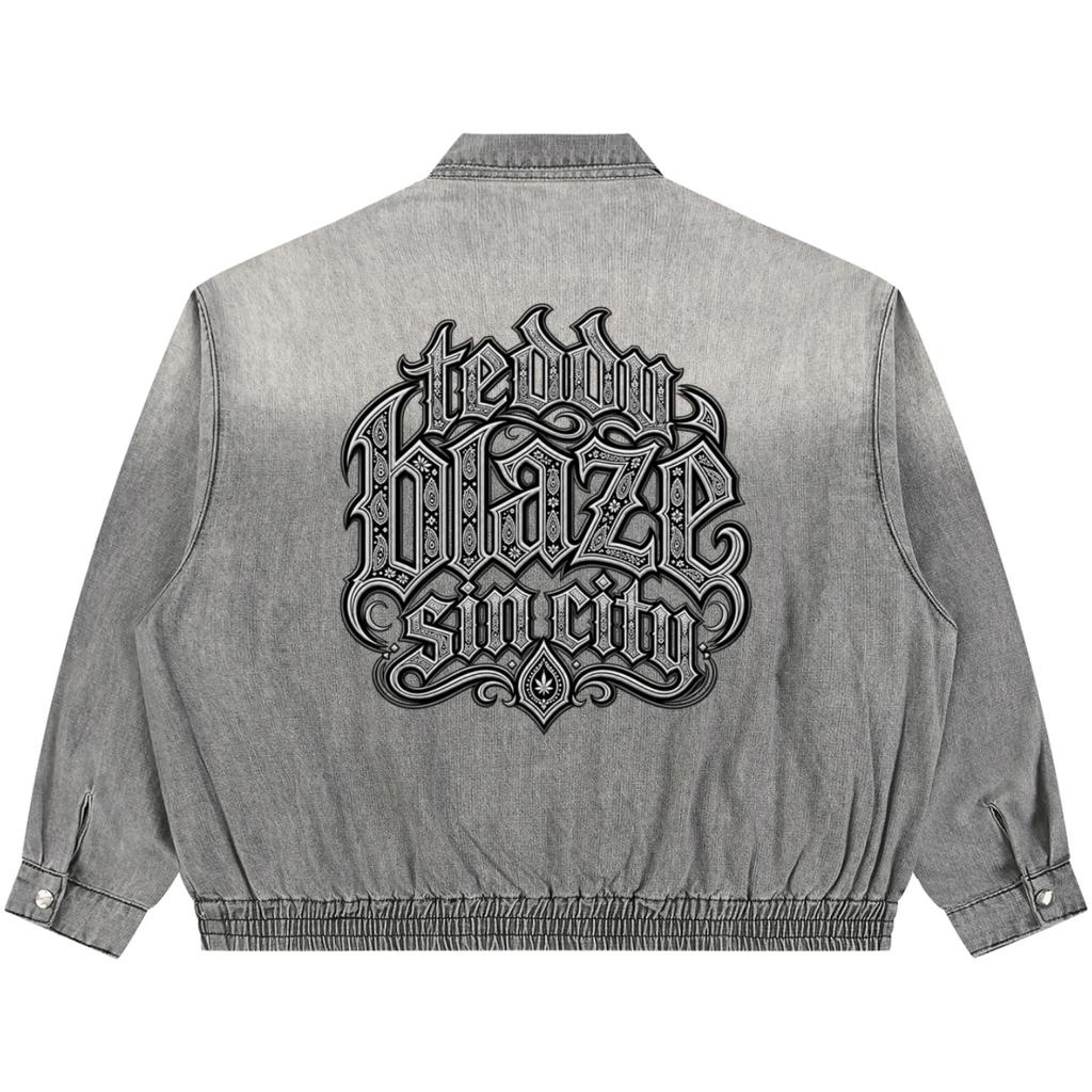 Elevate your transitional outerwear with the Teddy Blaze Sin City Vintage Wash Denim Jacket. Sun-washed gray denim, zip front, elastic hem, and filigree house back graphic. Shop NYC to Vegas style.