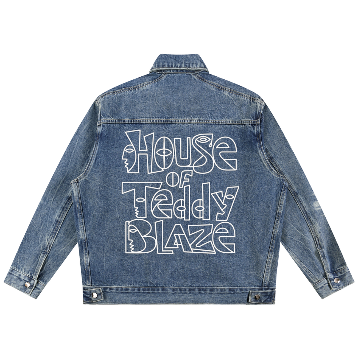 A blue denim jacket shown from the back, featuring a large white graphic text print that reads 'House of Teddy Blaze' across the back.