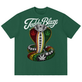 A dark green short-sleeve t-shirt featuring a graphic of a coiled snake decorated with cannabis leaves, with the text 'Teddy Blaze' written in white script above it, displayed on a solid white background.