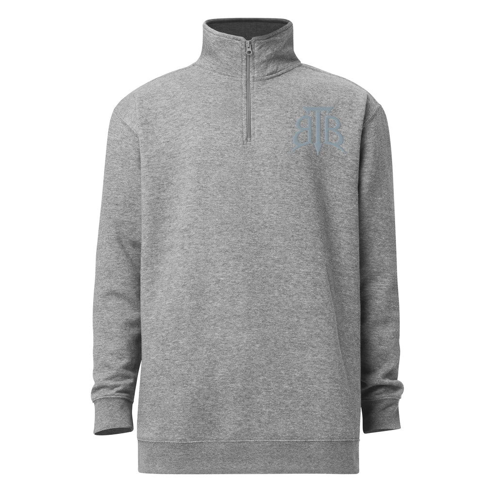 Shop the Embroidered BlazeCrest Fleece Quarter Zip by Teddy Blaze. 237 GSM carbon grey fleece pullover reflecting stealth wealth and quiet luxury from The Mature Mocha Collection.