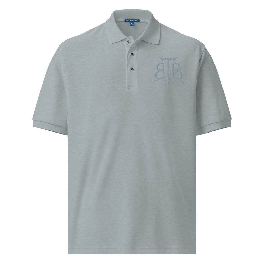 Shop the Embroidered BlazeCrest Polo by Teddy Blaze. 169.5 GSM ice blue pique polo embodying quiet luxury and stealth wealth from The Mature Mocha Collection.
