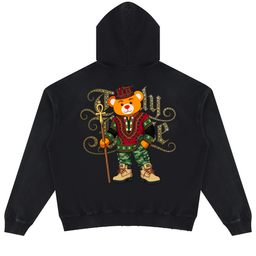 A black pullover hoodie shown from the back, featuring a large graphic of a teddy bear dressed in a red and green outfit with gold lettering behind it, on a plain white background.