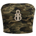 A strapless bandeau-style top with a green and brown camouflage pattern, featuring a large, ornate silver-toned double-helix brooch embellished with clear rhinestones at the center front.