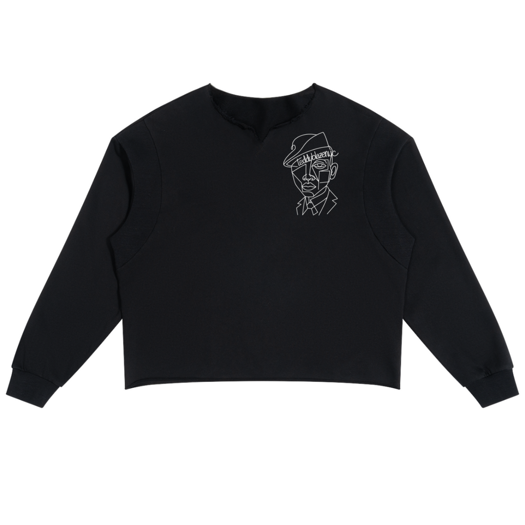 A black long-sleeve cropped sweatshirt with a white line-art graphic of a man's face wearing a hat on the left chest, displayed flat against a solid white background.