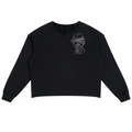 A black long-sleeve cropped sweatshirt with a white line-art graphic of a man's face wearing a hat on the left chest, displayed flat against a solid white background.