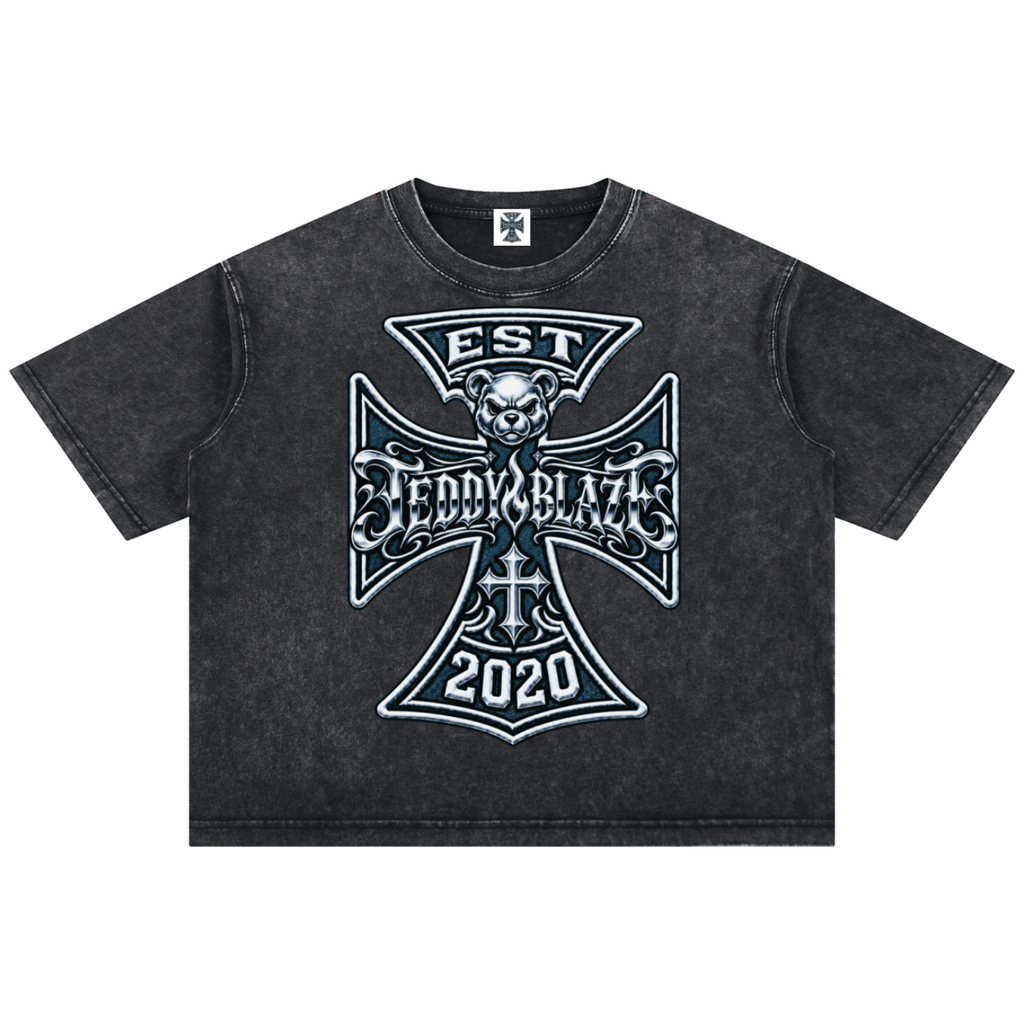 Shop the Fuego Cruz Mineral Washed Cotton Tee by Teddy Blaze. Heavyweight 275 gsm snow-wash cotton t-shirt with the DaCruz front crest and upper back gothic logo.