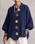 hop the Highland Statement Button Knit Cardigan Jacket by Ella Adire. Ribbed knit cardigan featuring oversized metallic buttons, turn-down collar, and lantern sleeves.