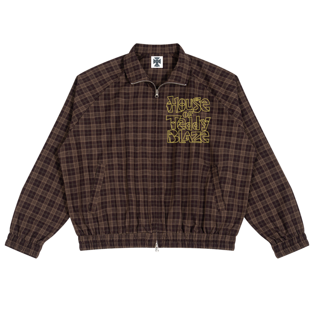 A brown and black plaid zip-up jacket with a yellow 'House of Teddy Blaze' graphic on the chest, displayed flat against a white background.